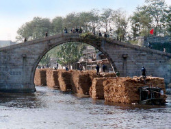 29 stacks of hay passing beneath a bridge in suzhou  china 800