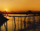 2 sunsetting at a bamboo bridge crossing the mekong river in thailand 800