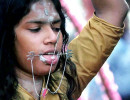 7 Tamil woman carrying a pail of milk 800